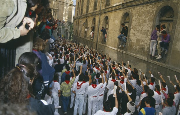 SPAIN, Navarra, Pamplona , San Fermin Bull Run Festival prayers in a narrow street  before bull run begins