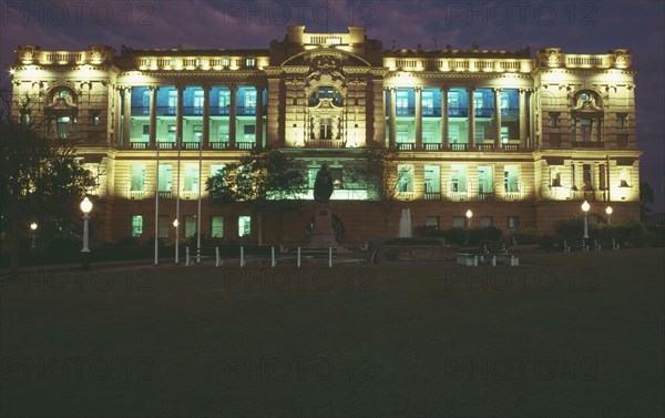 AUSTRALIA, Queensland, Brisbane, State buildings floodlit at night.