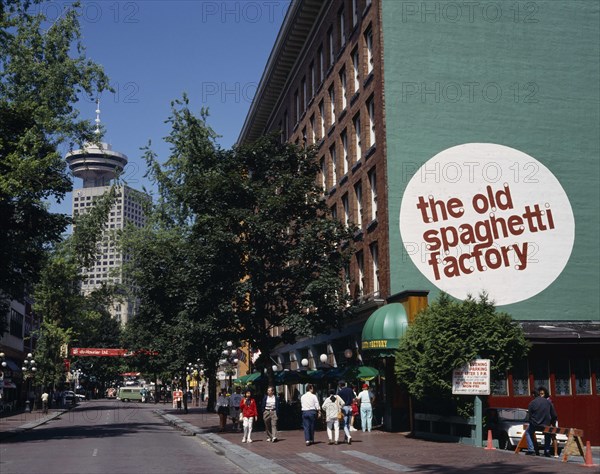 CANADA, British Columbia, Vancouver, Gastown. The Old Spaghetti Factory restaurant with people on the pavement