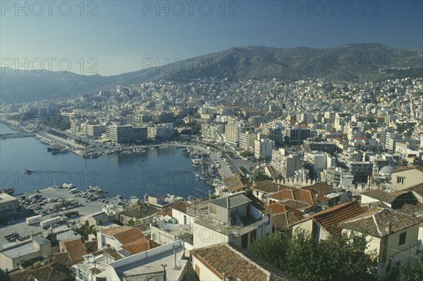 GREECE, Macedonia, Kavala, View over town buildings towards distant mountains.