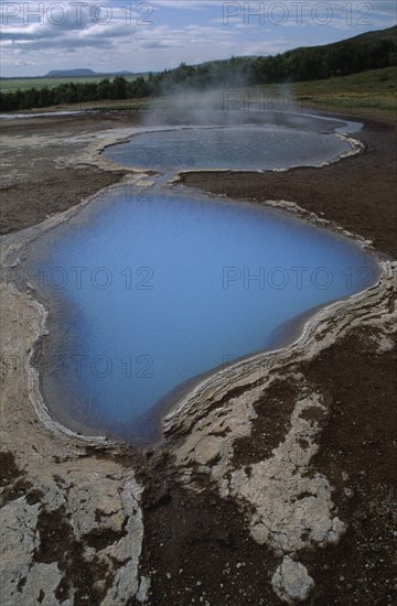 ICELAND, Landscape, Thermal pool with rising steam.