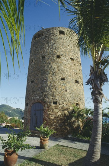 WEST INDIES, US Virgin Islands, St Thomas, Blackbeards Castle a small tower with blue door set on hillside