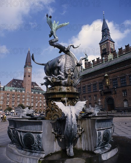DENMARK, Zealand, Copenhagen, City Hall and Fountain with statue of bull slaying a serpent in the foreground