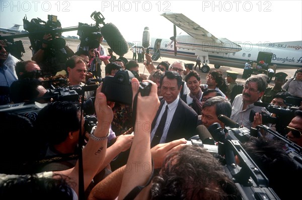 CAMBODIA, Politics, Press surrounding the arrival of Son Sen on airport runway.