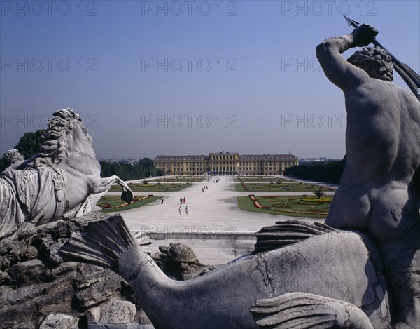 AUSTRIA, Vienna, Schonbrunn Palace beyond approach path with horse and man statue in foreground