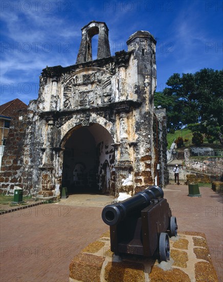 MALAYSIA, Malacca, Porto de Santiago ruined gateway and cannon of Portuguese fort.