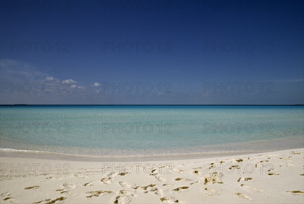 Cuba, Isla de Juventude, Caya Largo, Playa Serena, looking out to sea with footprints in white sand