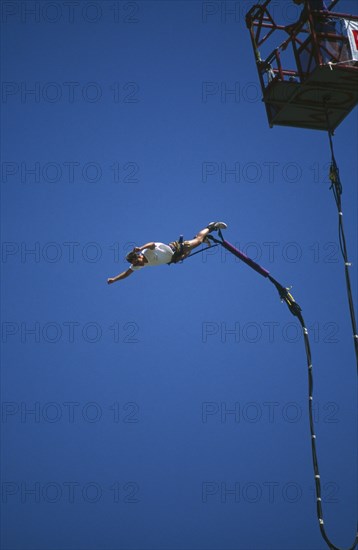 SPORT,  , Bungee Jumping, Man diving from a crane with elastic cord tied to his ankles