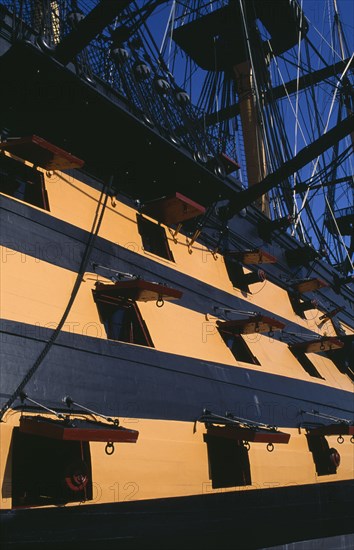 ENGLAND, Hampshire, Portsmouth, HMS Victory.  Part view of side of ship and openings from where cannons were fired.