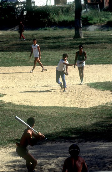 CUBA, Pinar del Rio, Young men playing a game of baseball
