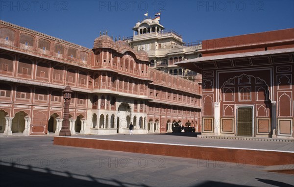 INDIA, Rajasthan, Jaipur, City Palace.  he seven storey Chandra Mahal overlooking courtyard arround the Diwan-i-Khas on the left.  Presence of the Maharaja is indicated by the flag flying above.