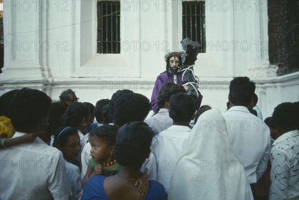 INDIA, Goa , Margao, Easter procession with people looking toward the Statue of Christ  with face visible.