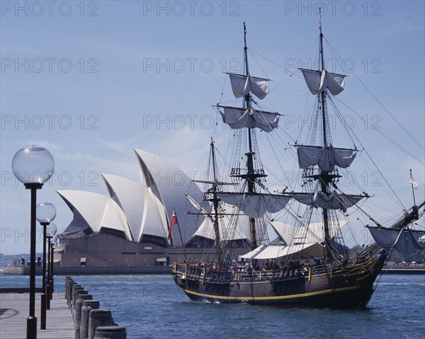 AUSTRALIA, New South Wales, Sydney, The Bounty harbour cruise ship arriving at The Rocks with the Opera House behind