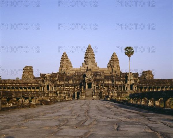 CAMBODIA, Angkor, Angkor Wat.  Causeway leading to main temple and triple pagodas.