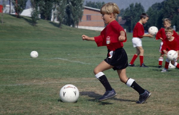 10045938 SPORT Ball Games Football Young boys at football coaching school.