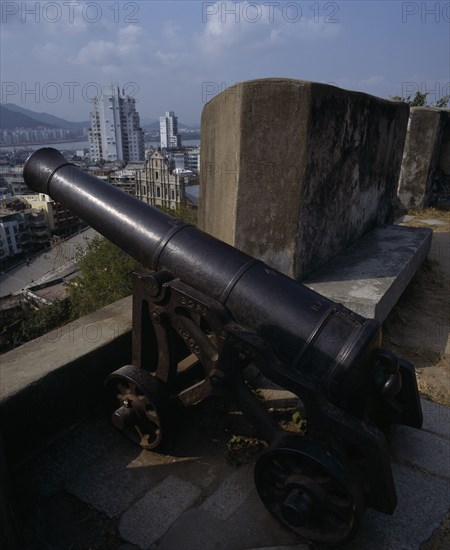MACAU, Sao Paulo , Fortaleza Do Monte. Black cannon with view to Sao Paulo Church below