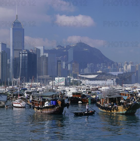 HONG KONG, Causeway Bay, Typhoon Shelter with Sampans and Junks with Wanchai skyline beyond