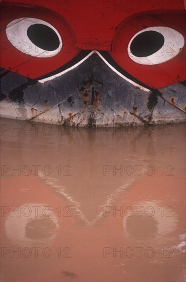 VIETNAM, My Tho, Detail of boat with traditional painted decoration depicting a pair of guarding eyes