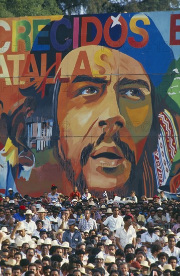CUBA, Santiago De Cuba, Santiago, Crowd in front of  giant Che Guevara painting at 35th Anniversary of The Revolution