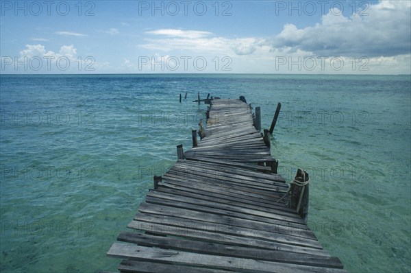 CUBA, Ciego De Avila, Cayo Guillermo, Derelict wooden jetty leading out to sea