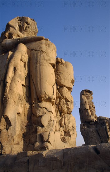 EGYPT, Thebes, The Colossi of Memnon the only remains of the Mortuary Temple of  Amenophis III