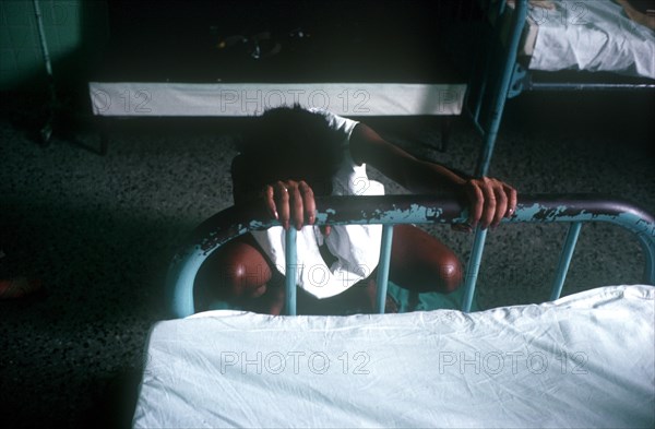 CUBA, Havana, Pegnant woman enduring labour pains in hostital ward