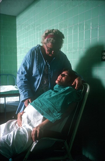 CUBA, Havana, Pregnant woman in labour being attended by hospital nurse