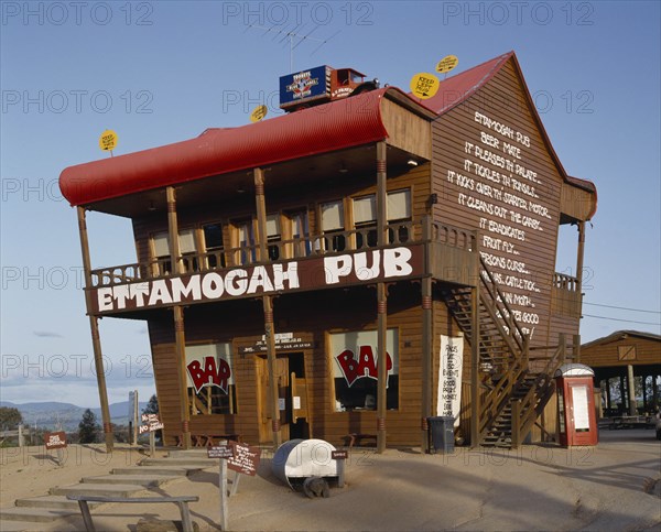 AUSTRALIA, New South Wales, Near Albury, Ettamogah Pub an unusual timber building with a red roof and odd signs