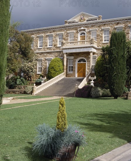 AUSTRALIA, South Australia, Barossa Valley, Chateau Yaldara at Lyndock. The front entrance with wide steps to the house beyond the lawns and trees