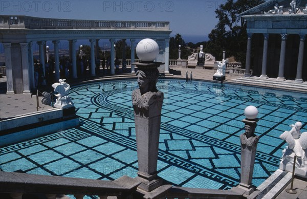 USA, California, Randolph Hearst Castle, Greek Pool with columned surround and people gathered in the shade underneath