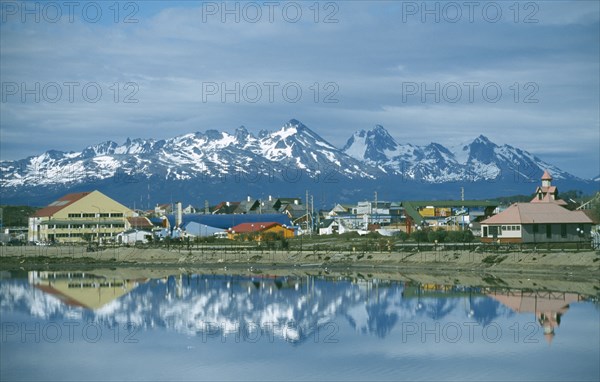 ARGENTINA, Patagonia, Tierra del Fuego, "Ushuaia, view of town with snowcapped mountains of Chile across water "