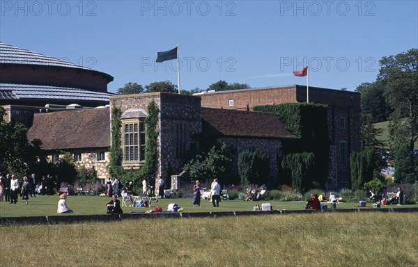 ENGLAND, East Sussex, Glyndebourne, "New theatre, exterior with audience members crossing the lawn in front"