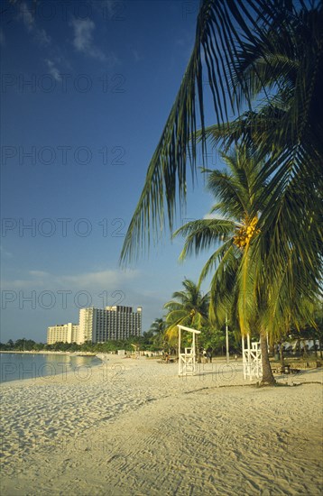 WEST INDIES, Jamaica, Ocho Rios , Beach with hotel in the distance