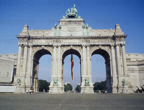 BELGIUM, Brabant, Brussels, "Arc du Triomphe, the Arch in the Cinquantenaire park and hanging Belgian flag."