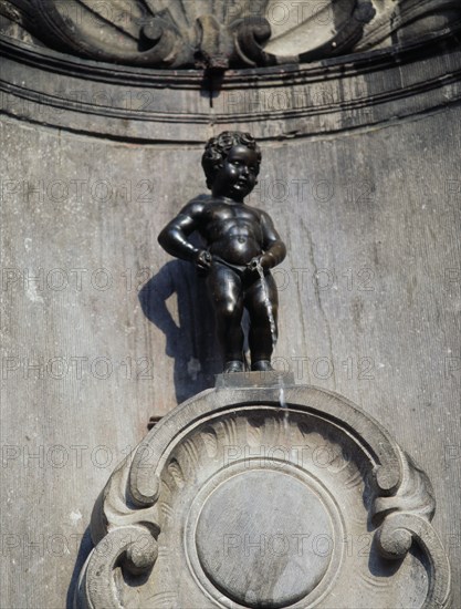 BELGIUM, Brabant, Brussels, "Manneken Pis, a statue of a little boy urinating into the fountain's basin."