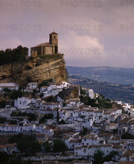 SPAIN, Andalucia, Granada Province, "Montefrio, general view of hillside town with white houses & church on hilltop "