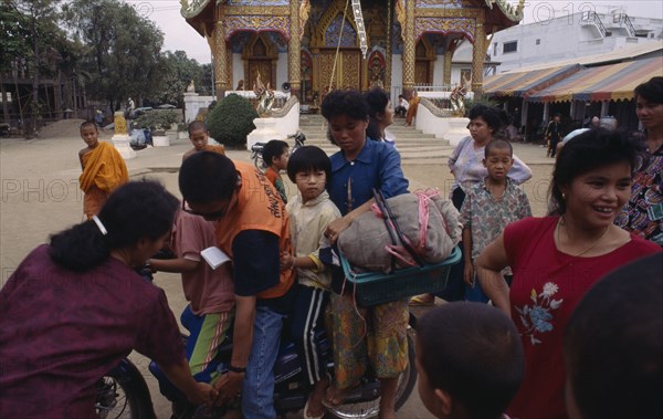 THAILAND, North, Mae Sai, Karen refugee family on a motorbike