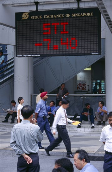 SINGAPORE, Raffles Place, "City, financial centre, OUB Plaza City workers infront of Straits Times Index Singapore Stock Exchange on board "