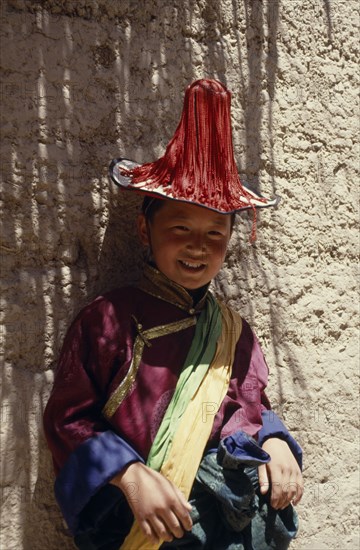 CHINA,  , Qinghai, Young Tibetan boy dressed in festival dancing costume