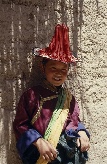 CHINA, , Qinghai, Young Tibetan boy dressed in festival dancing costume