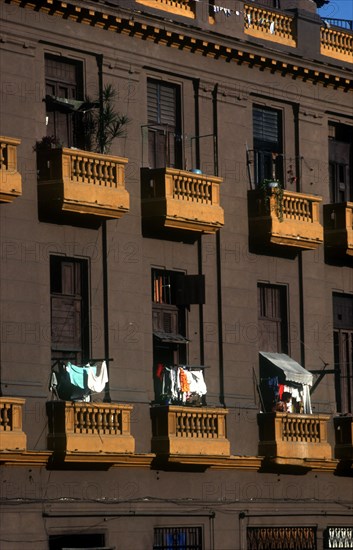 CUBA, Havana , Brown coloured balconies with hanging washing