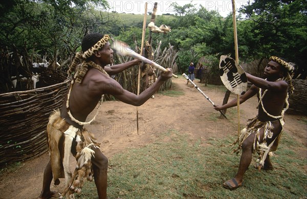 SOUTH AFRICA, KwaZulu Natal , Melmoth, Zulu men demonstrating traditional fighting with sticks