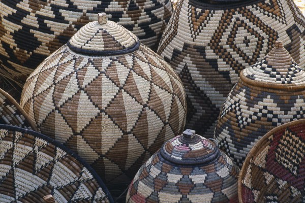 SOUTH AFRICA, Zululand  , Baskets woven by Zulu women made from Lala Palm and coloured with juices from tree roots.