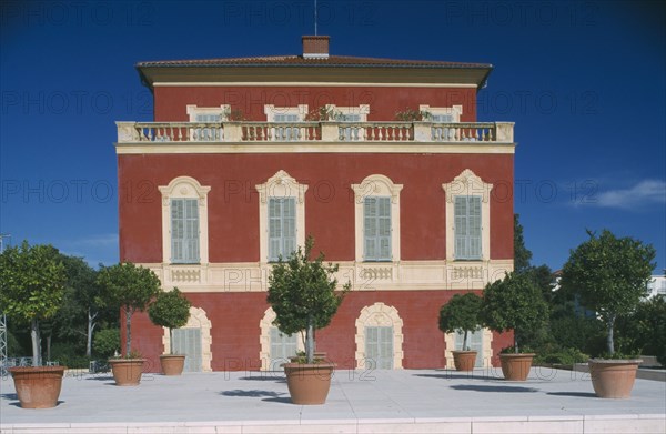 FRANCE, Provence Cote D’Azur  Alpes Maritime, Nice , Matisse Museum facade with shrubs in pots on paved area