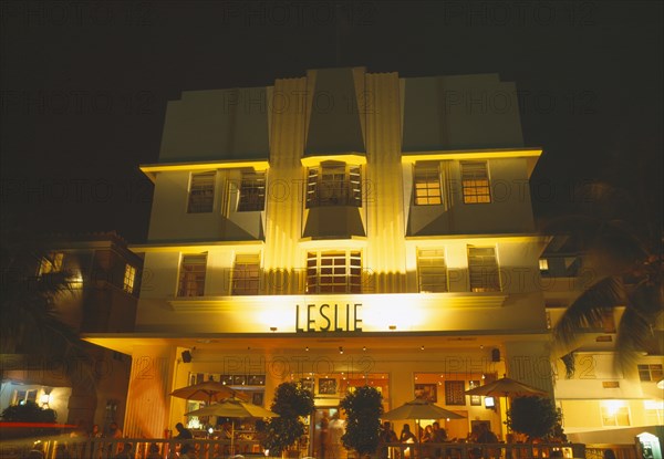 USA, Florida , Miami , South Beach. Ocean Drive Art Deco Buildings at night Leslie Building & diners in restaurant