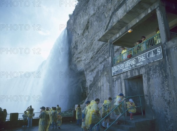CANADA, Ontario  , Niagara Falls, The Horseshoe Falls waterfall Journey behind the Falls people in yellow macs underneath the falls