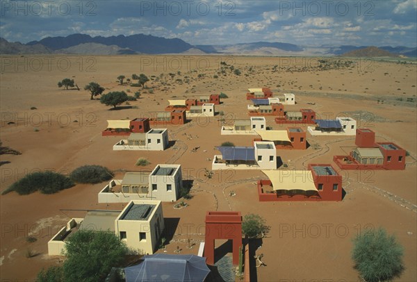 NAMIBIA, Namib Dessert, Sussusvlei, Karos Lodge. View over cluster of Hotel buildings on the edge of the desert