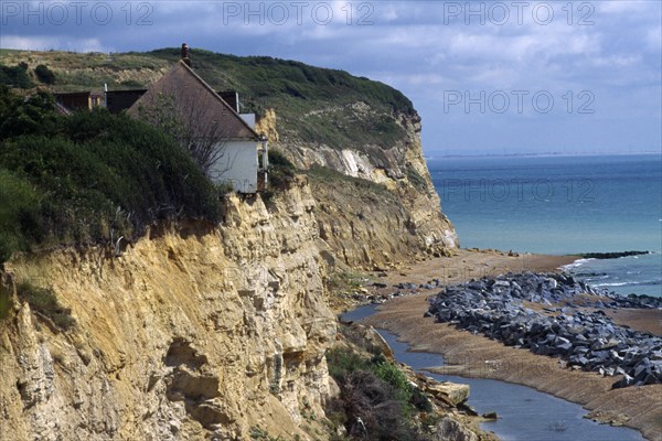 CLIMATE, Erosion, House on the edge of an eroded cliff at Fairlight in Sussex caused by severe coastal erosion
