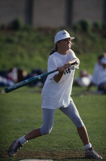 10097177 SPORT Ball Games Softball Female player at the plate swinging to strike the ball during the World Corporate Games in London in 1992