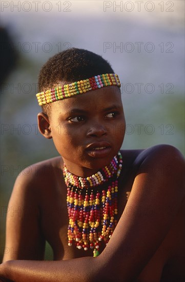 SOUTH AFRICA, KwaZulu Natal, Shakaland , Zulu woman with an ujelasi necklace and head band